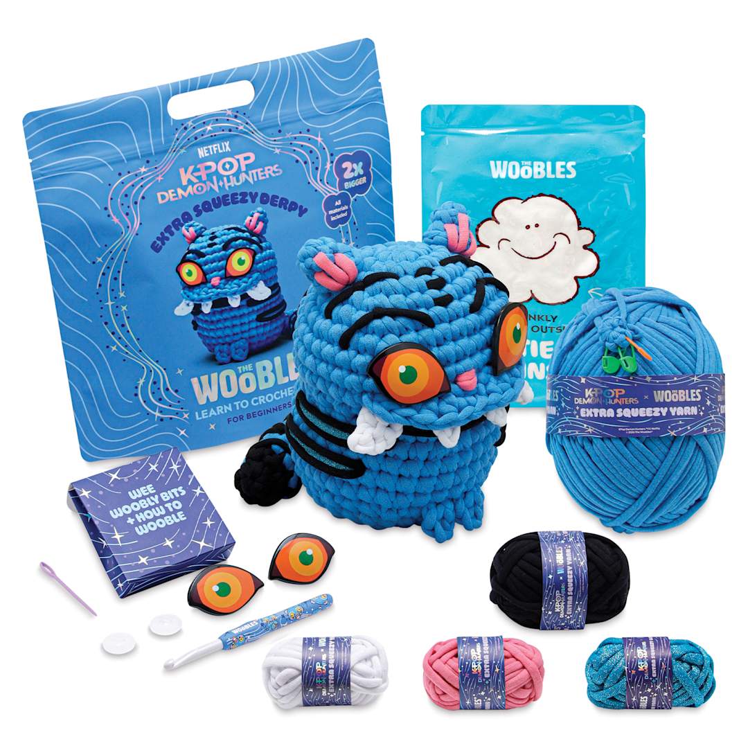 Open in modal - The Woobles Extra Squeezy Crochet Kit - Derpy the Tiger contents with completed project