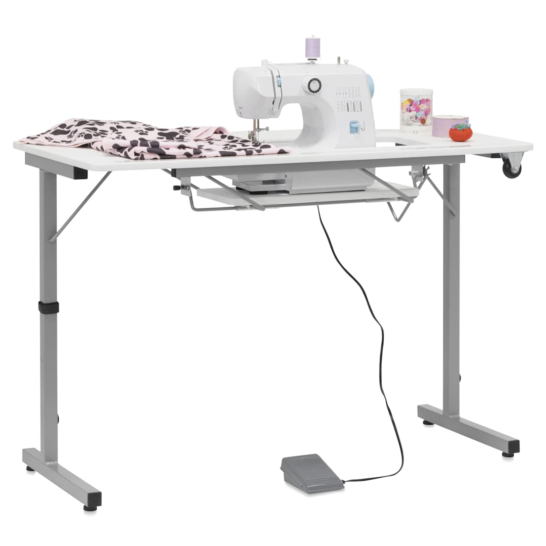 Open in modal - Studio Designs Rollaway II Sewing Table - shown with sewing machine and supplies, not included