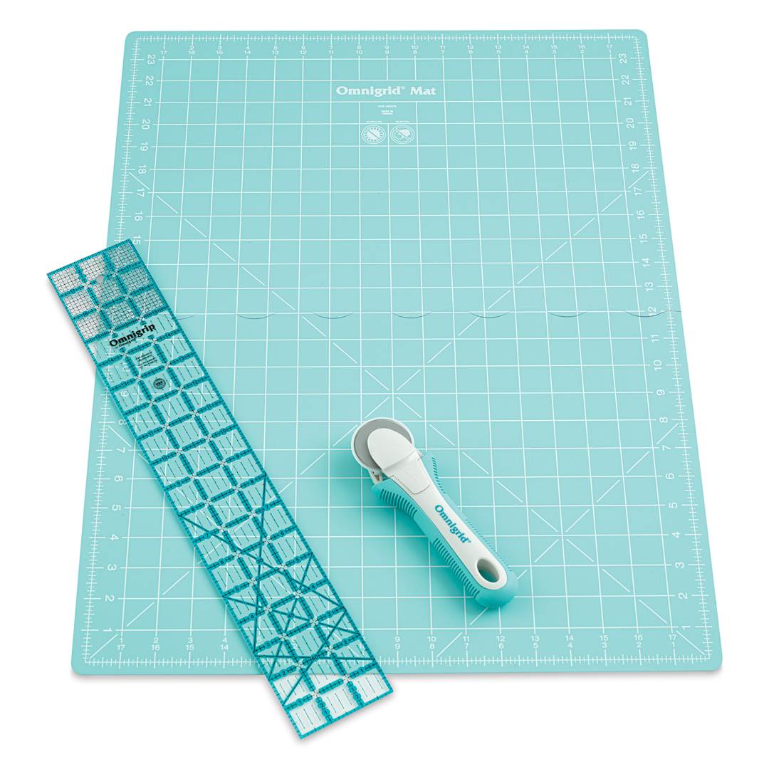 Open in modal - Rotary cutter with large unfolded mat and ruler laid out