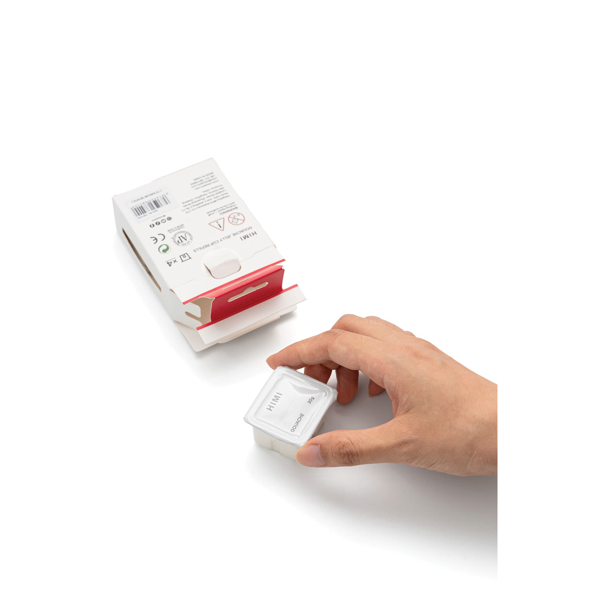 A hand holding a refill cup.