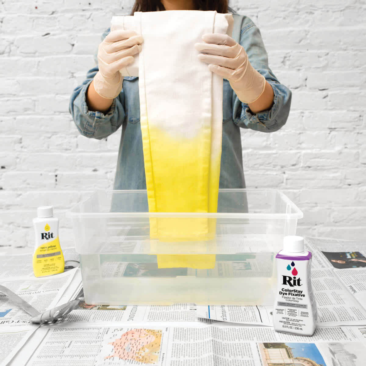 Rit Color Stay Dye Fixative -Woman using fixative on newly dyed pants