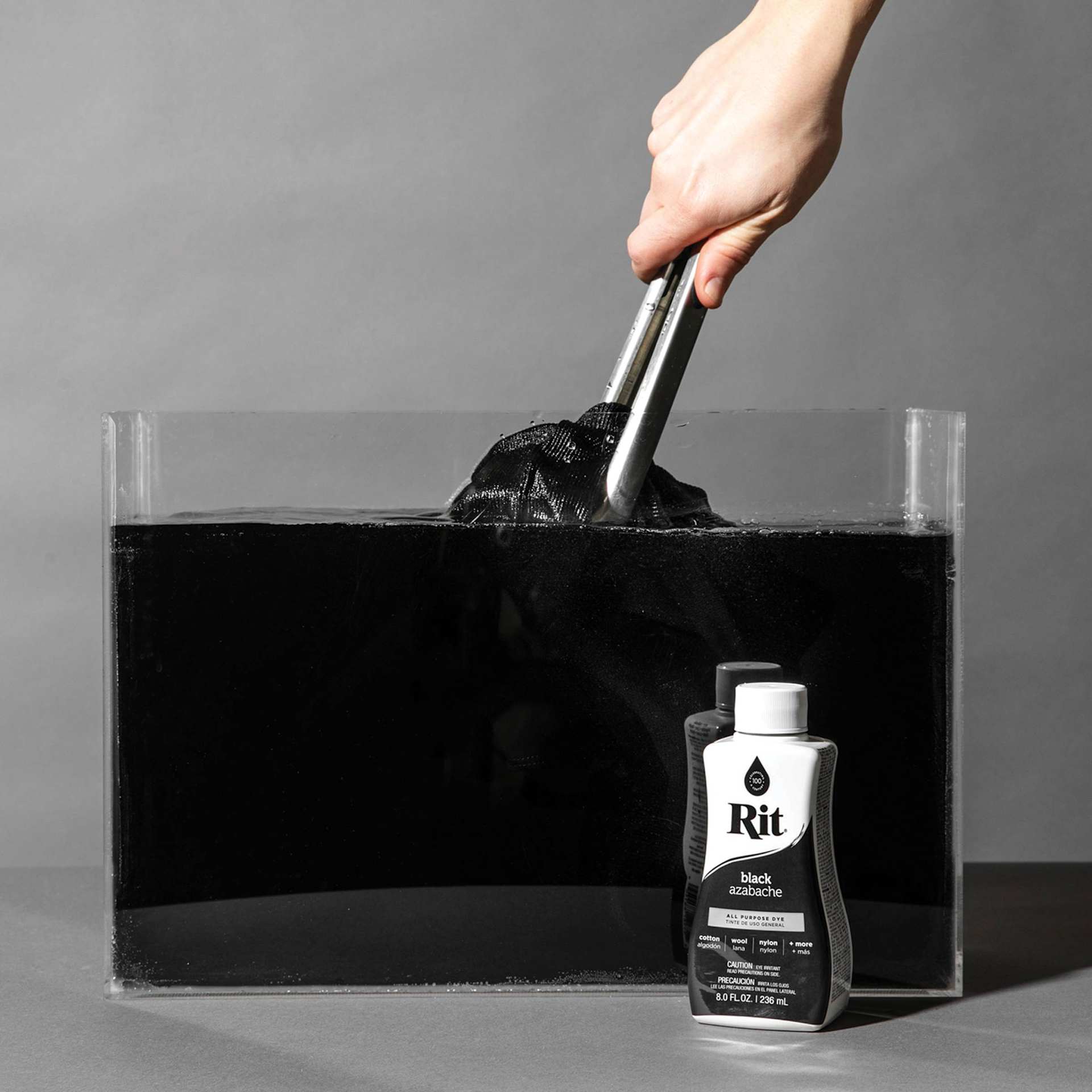 Rit All Purpose Liquid Dye - Black, 8 oz, submerging fabric in dyed water