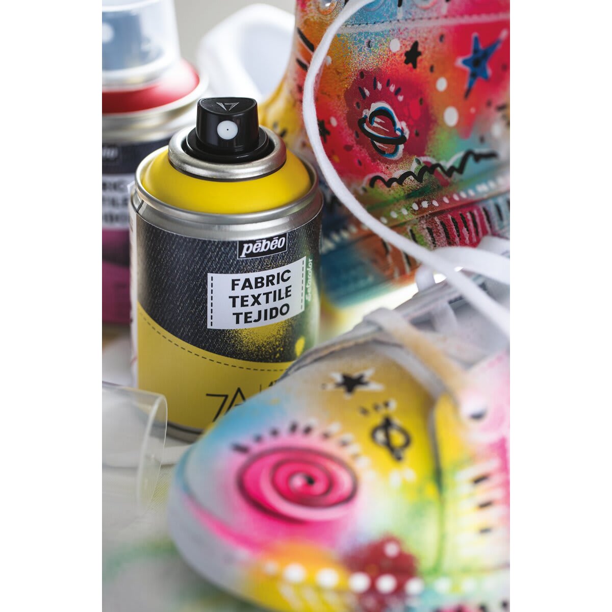 Pebeo 7A Fabric Spray Paint - Yellow can on workbench with painted sneaker