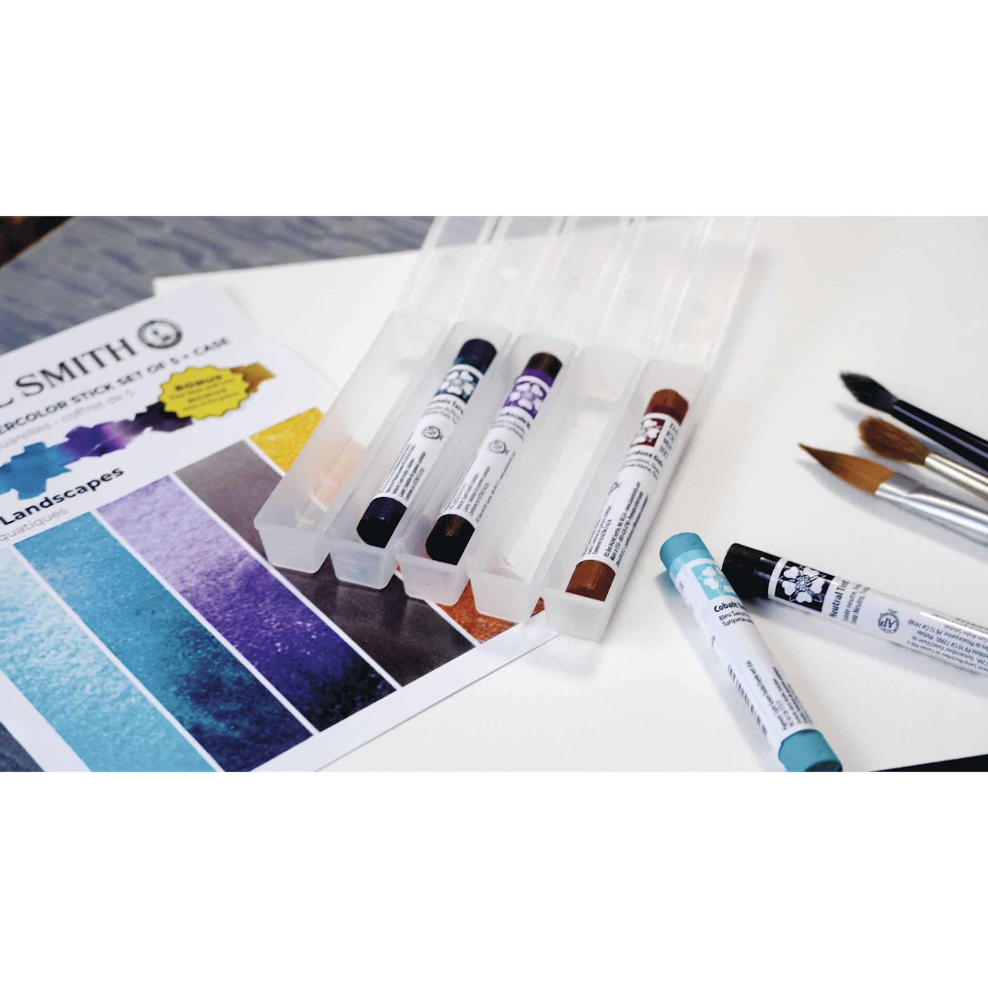 Daniel Smith Extra Fine Watercolor Sticks, on table with other art materials
