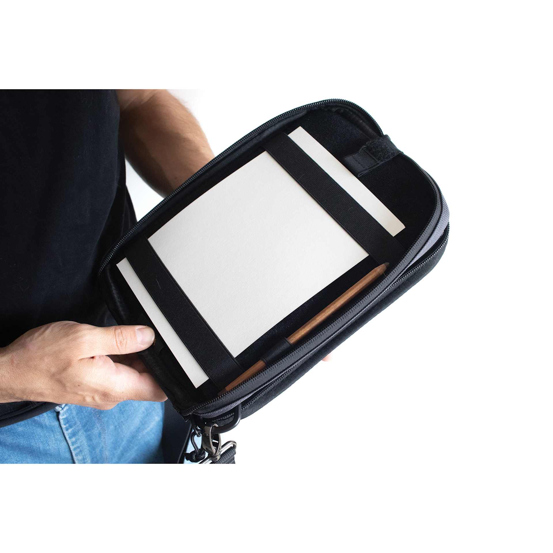 Etchr Nano Satchel - Grey, in hand showing drawing pad inside (pad not included)