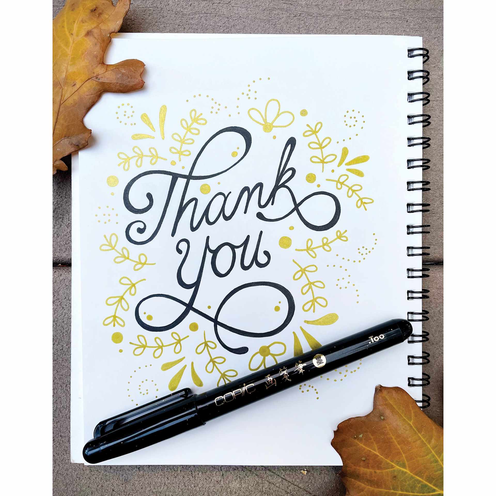 Copic Gasenfude Brush Tip Pen on sketchbook with hand lettering.