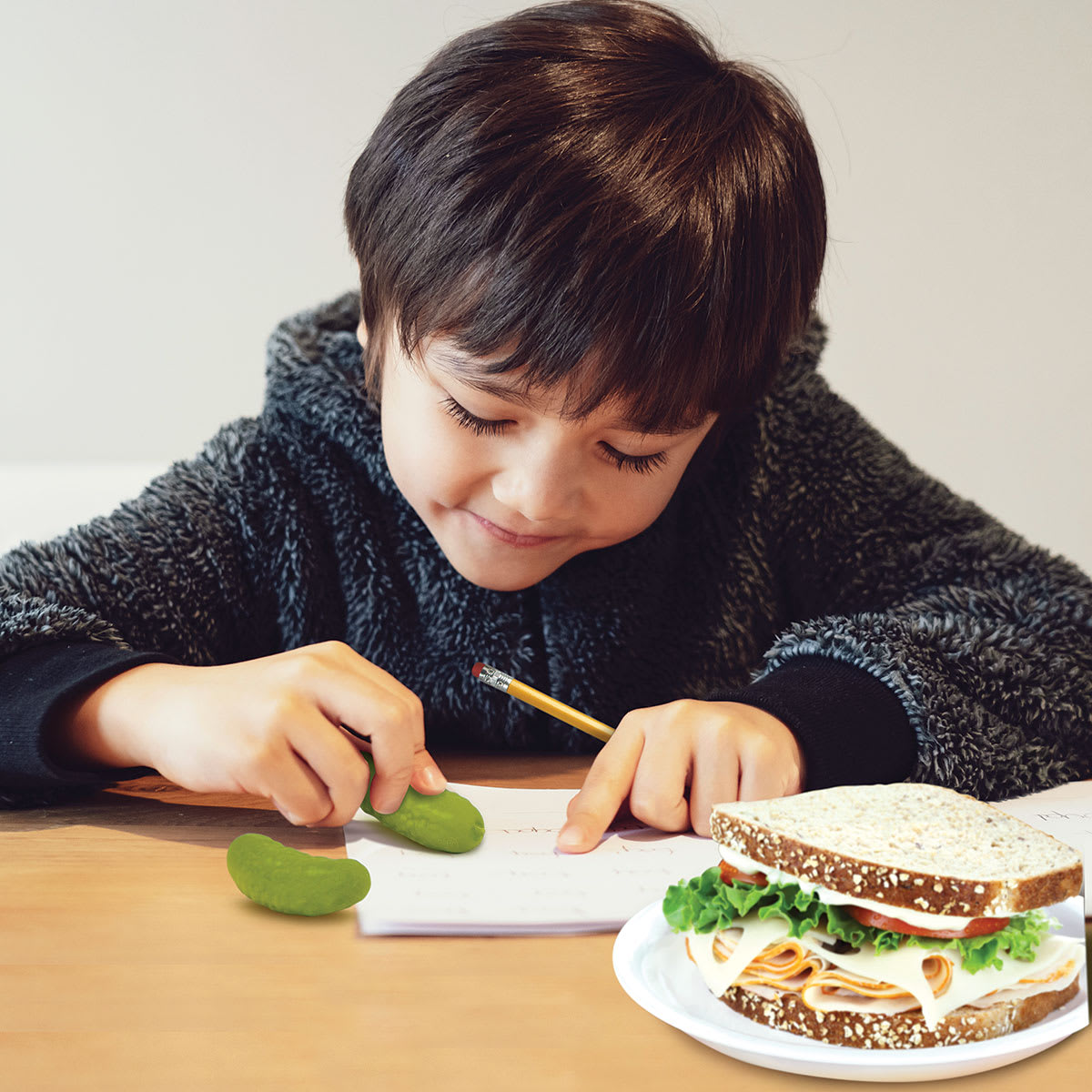 Fred Pickle Erasers, child using erasers