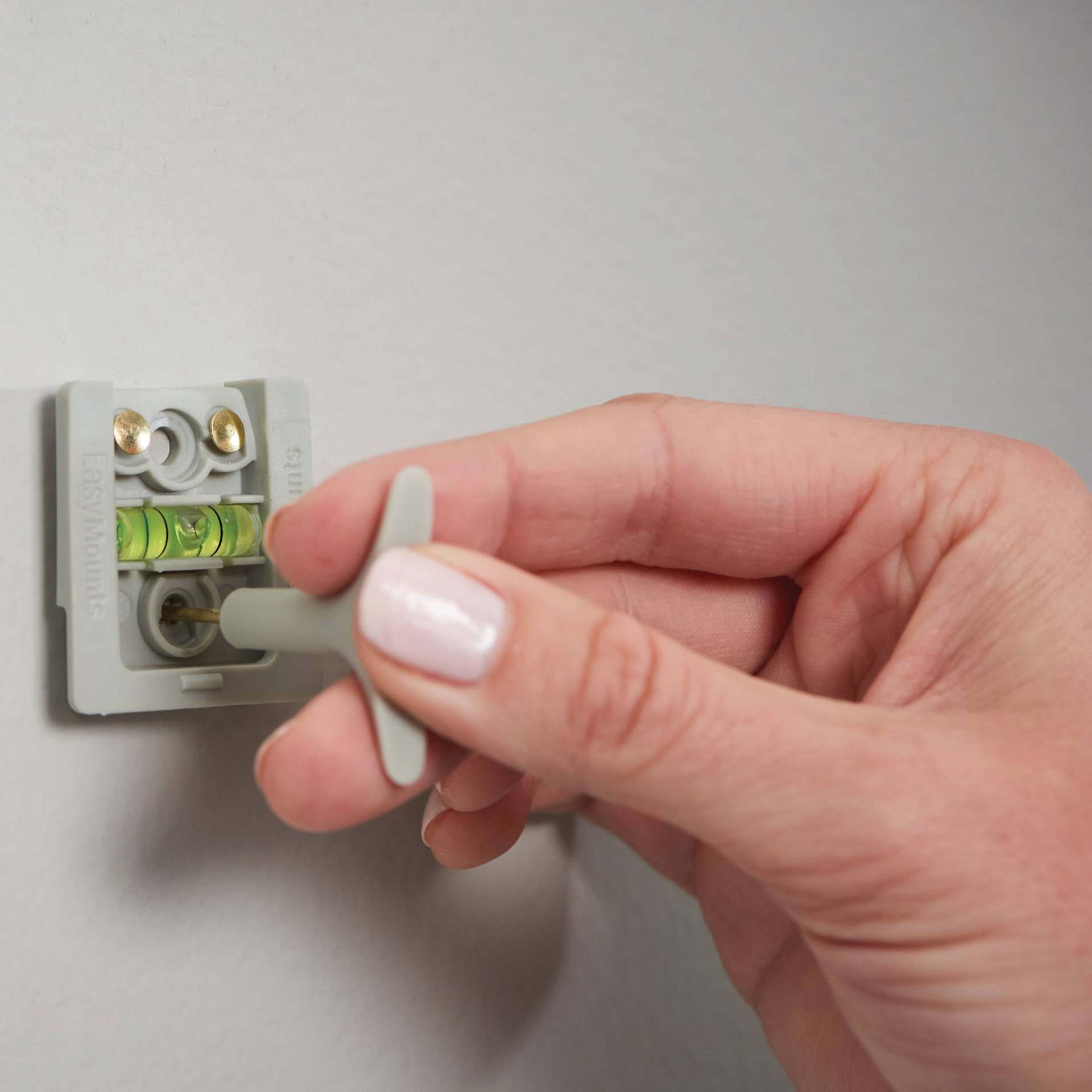 Duck EasyMounts Interior Drywall Picture Hanger - Pkg of 2, demonstrating how to center the hanger.