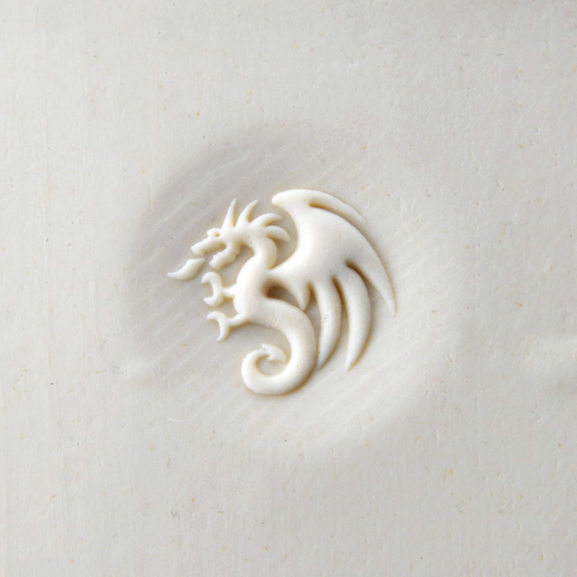 MKM Pottery Tools Curve Top Stamp - Dragon, pressed into clay