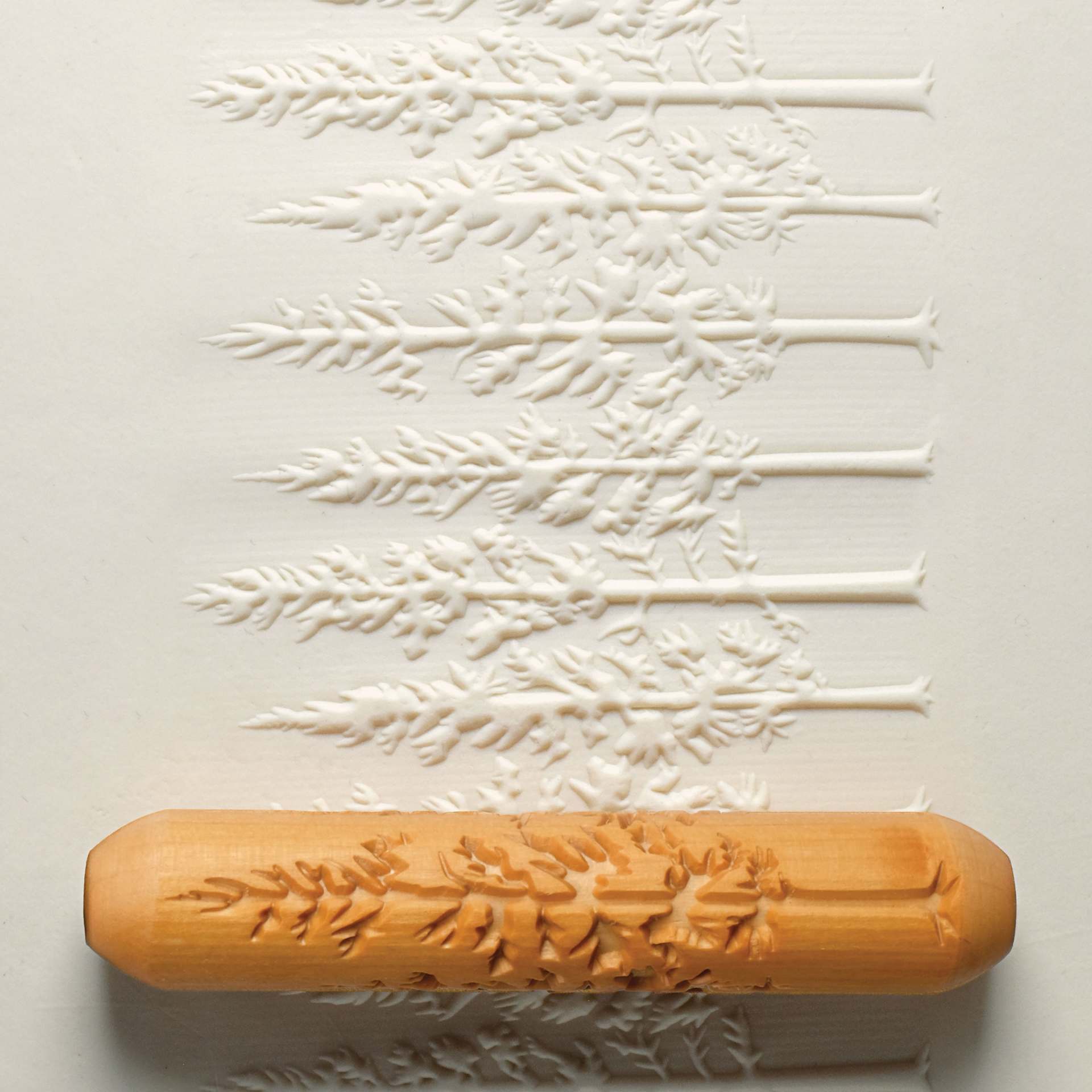 MKM Pottery Tools Big Hand Roller - Mountain Forest applied to clay
