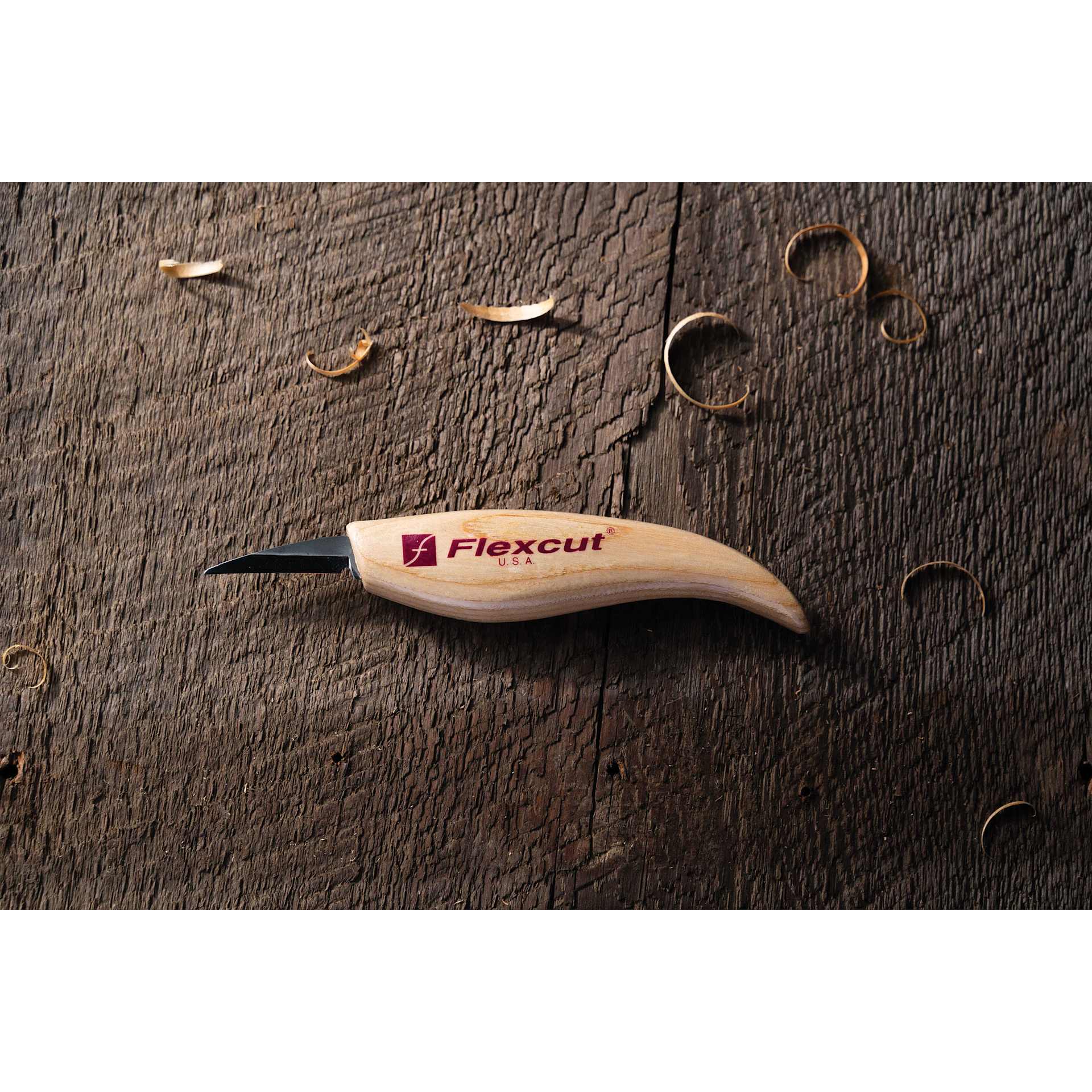 Flexcut Detail Knife laying with wood shavings