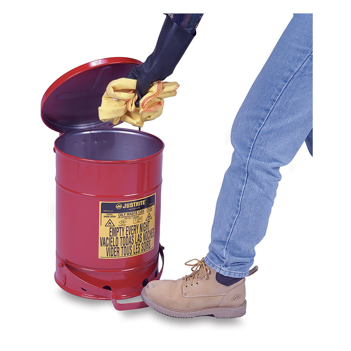 Justrite Oily Materials Waste Cans - Worker depositing oily cloths using foot lever to open can