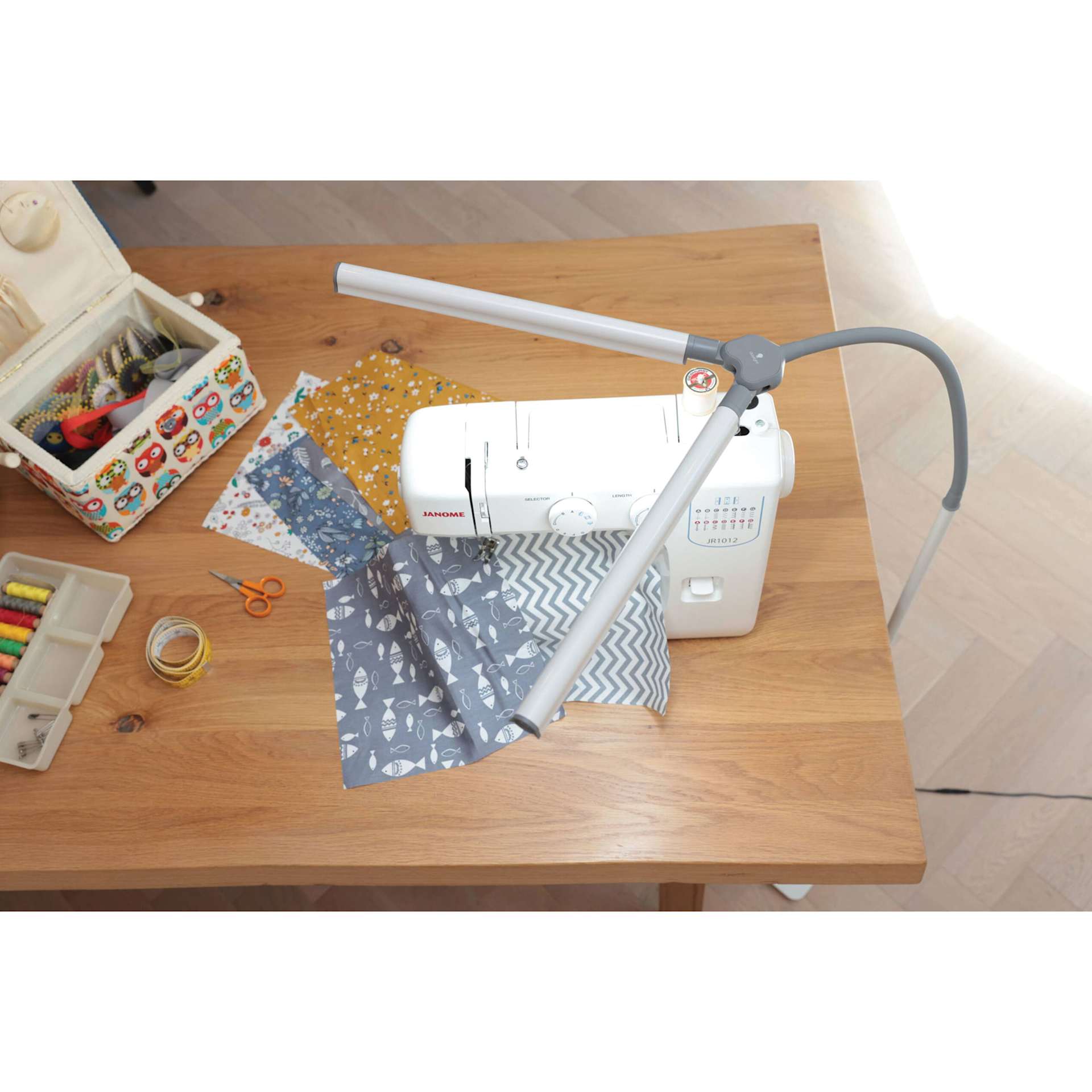 Daylight DuoPro Floor Lamp - top view of lamp lit over sewing table