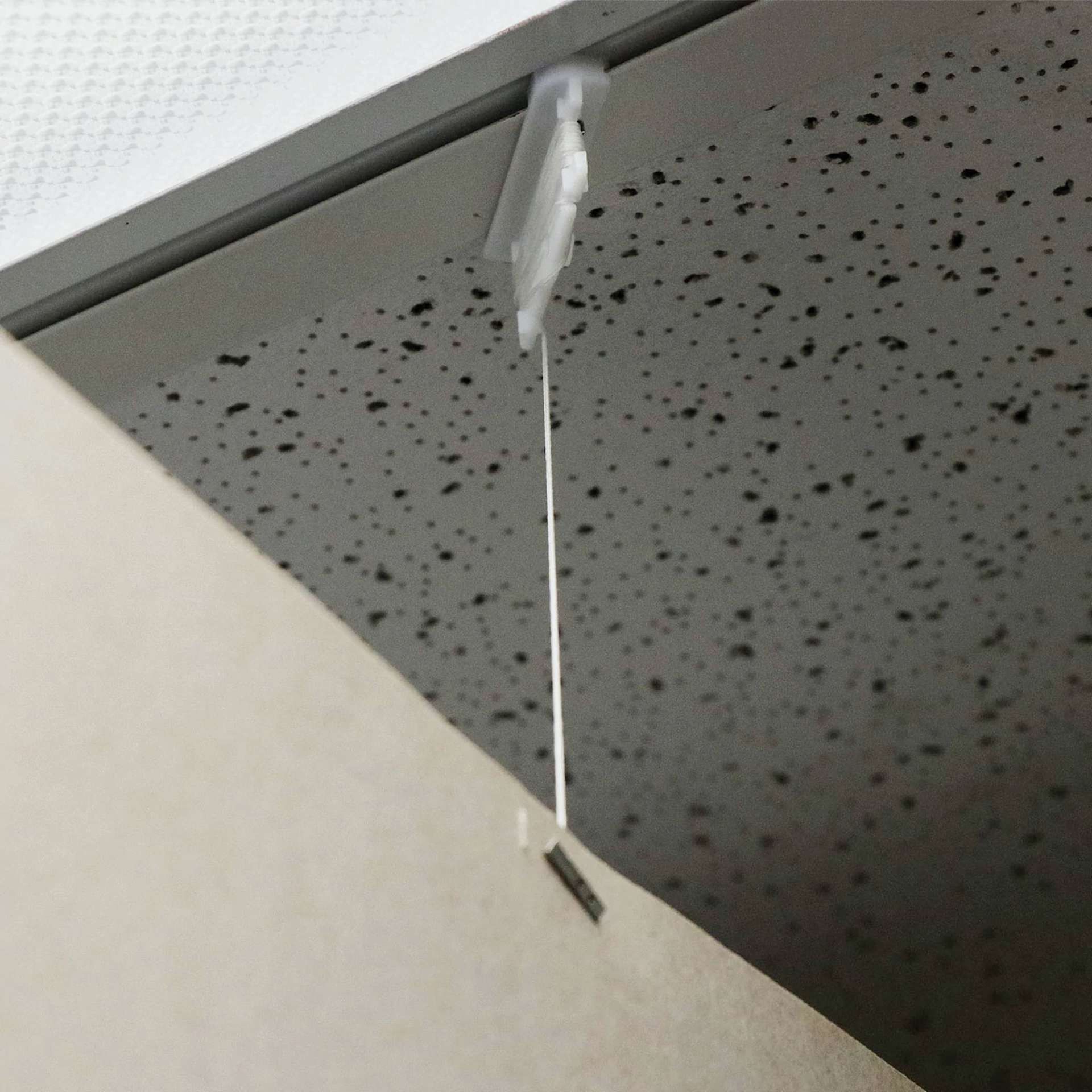 StikkiWorks Ceiling Hanglers Grid Clip Kits - Closeup of Clip in Ceiling