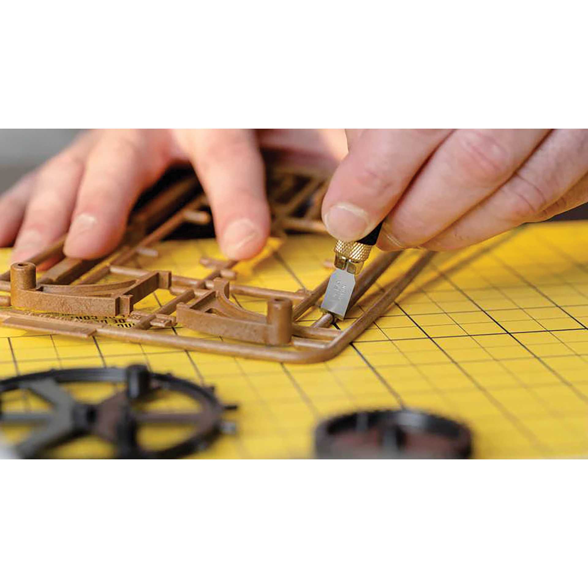 Olfa Chisel Art Blades - chisel being used to carve out 3D printed assets from supports