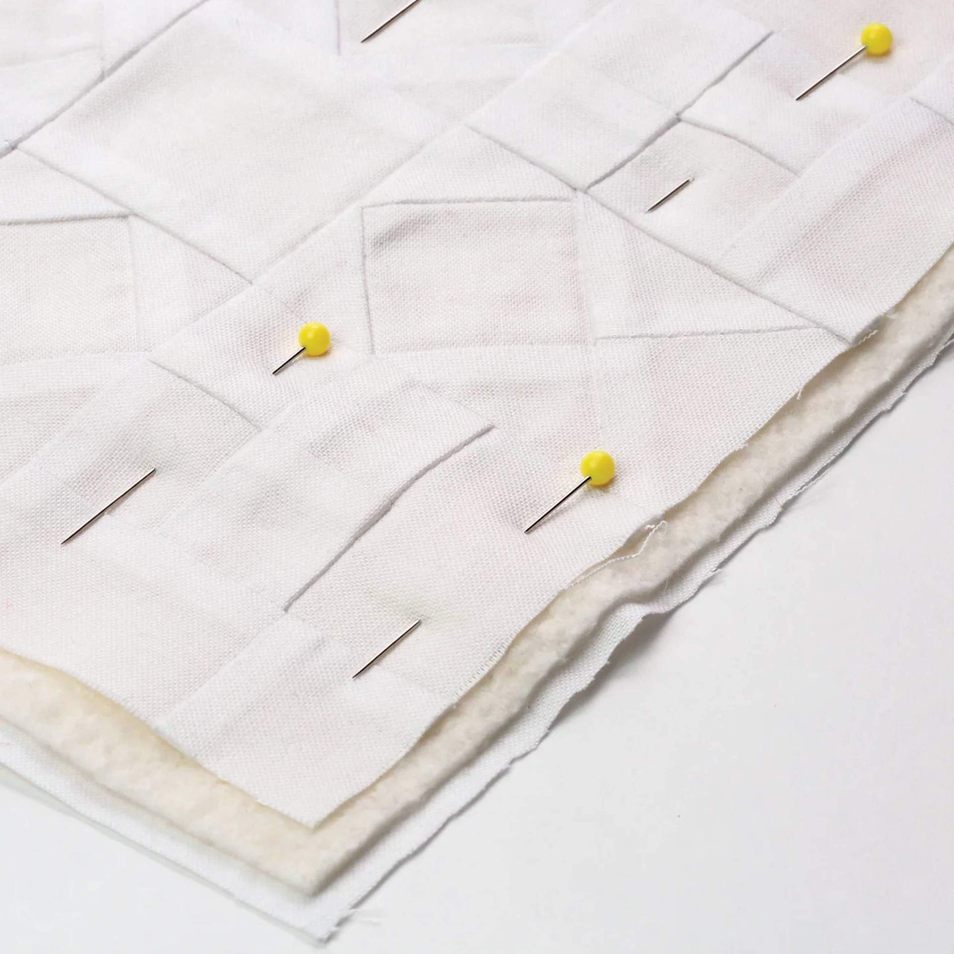 Dritz Quilting Pins, being used on fabric