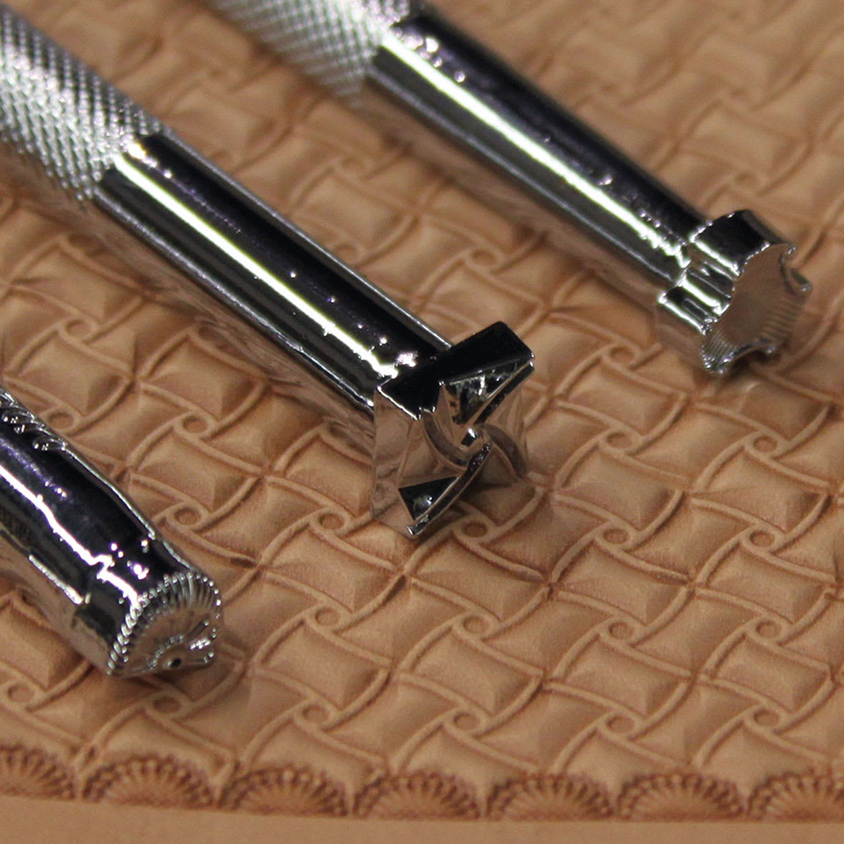 Realeather Geometric Stamp Set - Closeup of three handles with different stamps on each end
