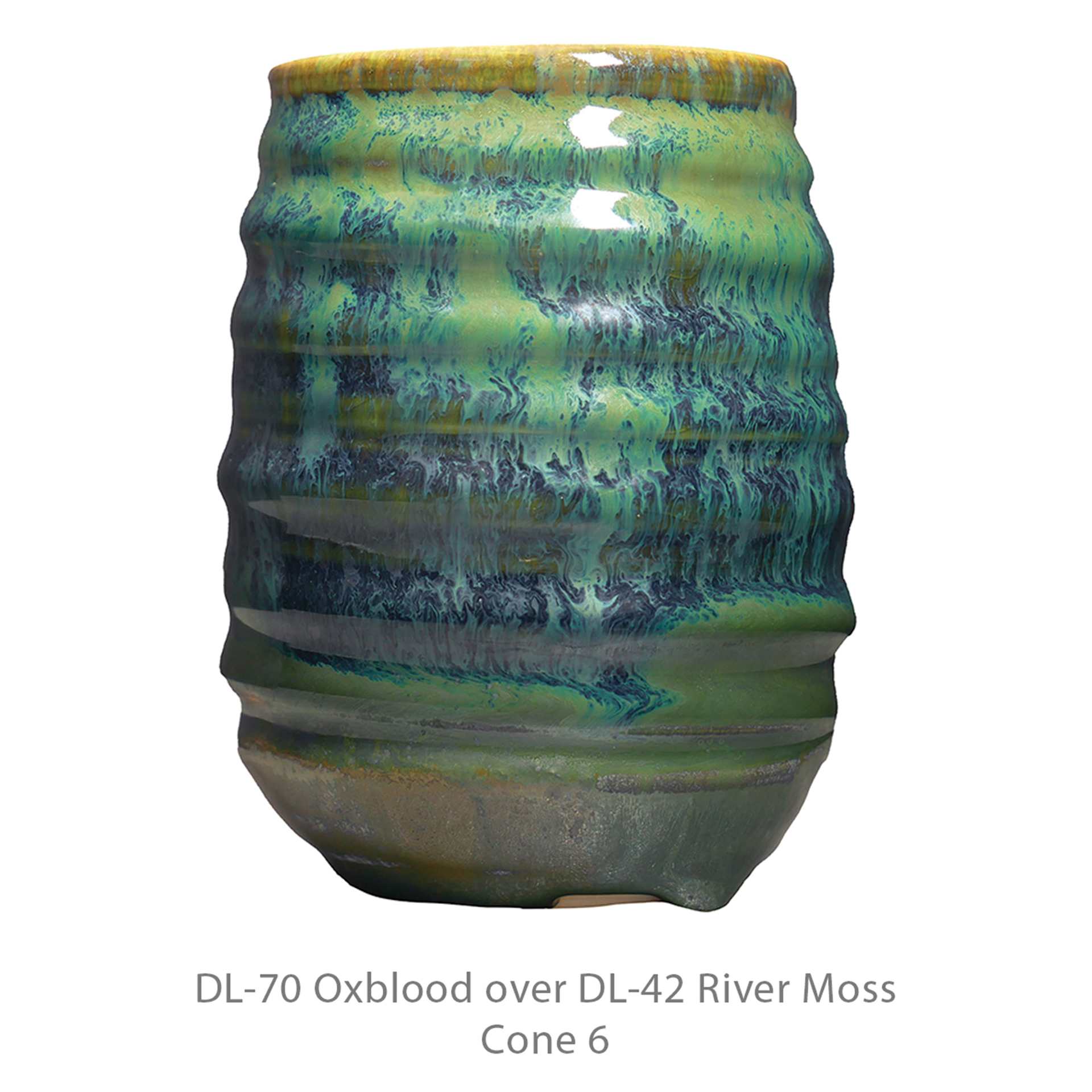 DL-70 Oxblood over DL-42 River Moss. Cone 6.