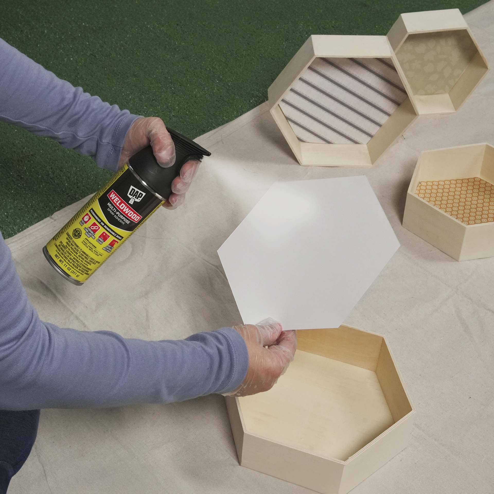 DAP Weldwood Multi-Purpose Spray Adhesive - 11 oz Can applied onto hexagon shelf backing