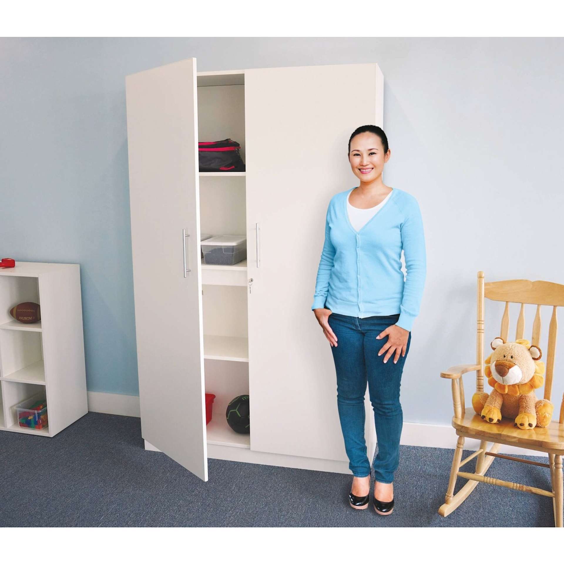 Whitney Brothers White Tall and Wide Wall Cabinet (Woman standing next to cabinet)