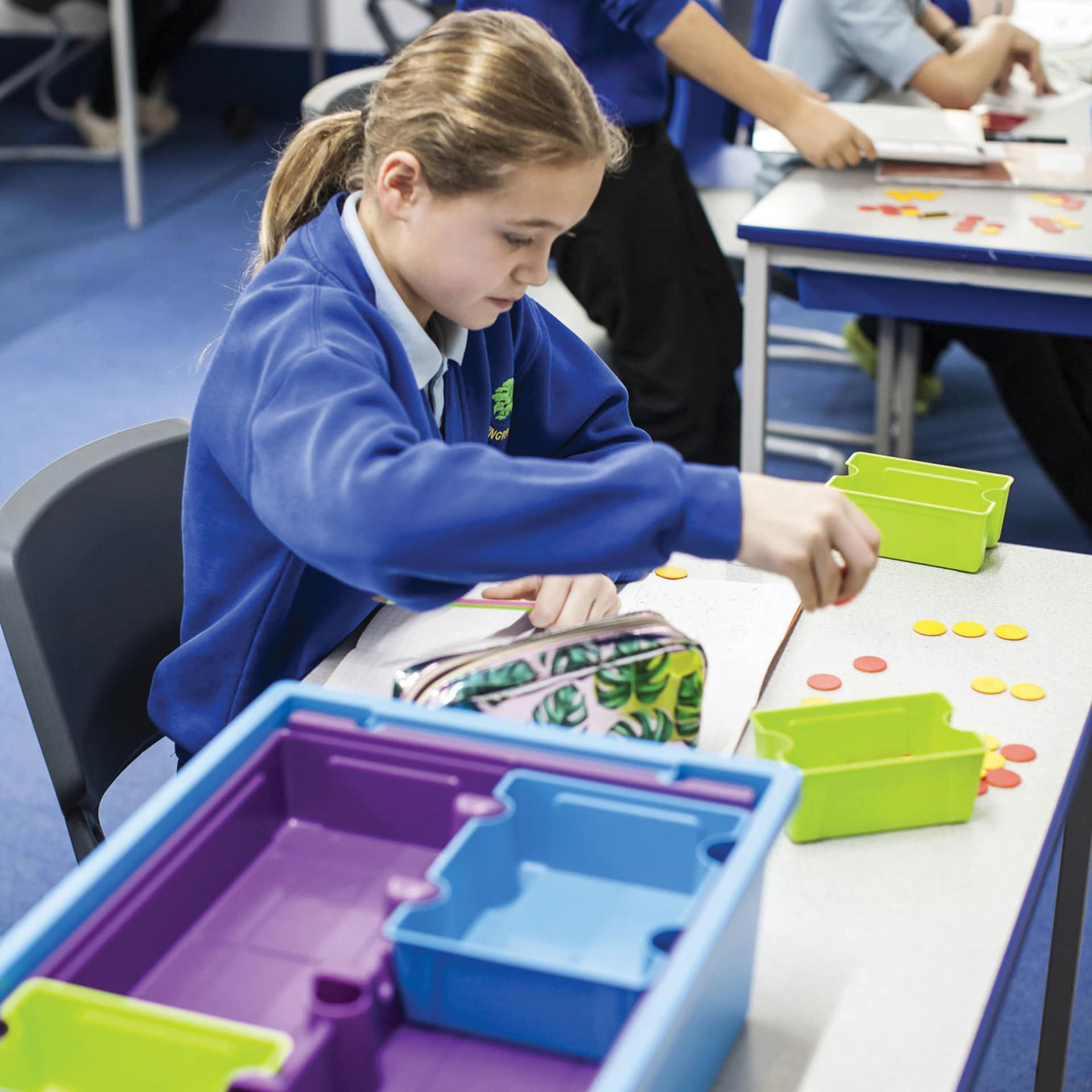 Gratnells Sorted Tray Inserts - Bright, Set of 52 (child using the dividers in a larger tote, larger tote sold separately)