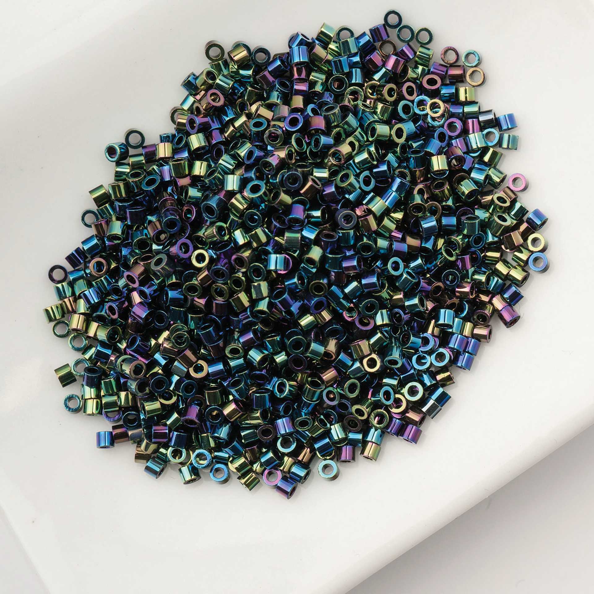 John Bead Cylin 11/0 Cylindrical Seed Beads - Black AB held in dish