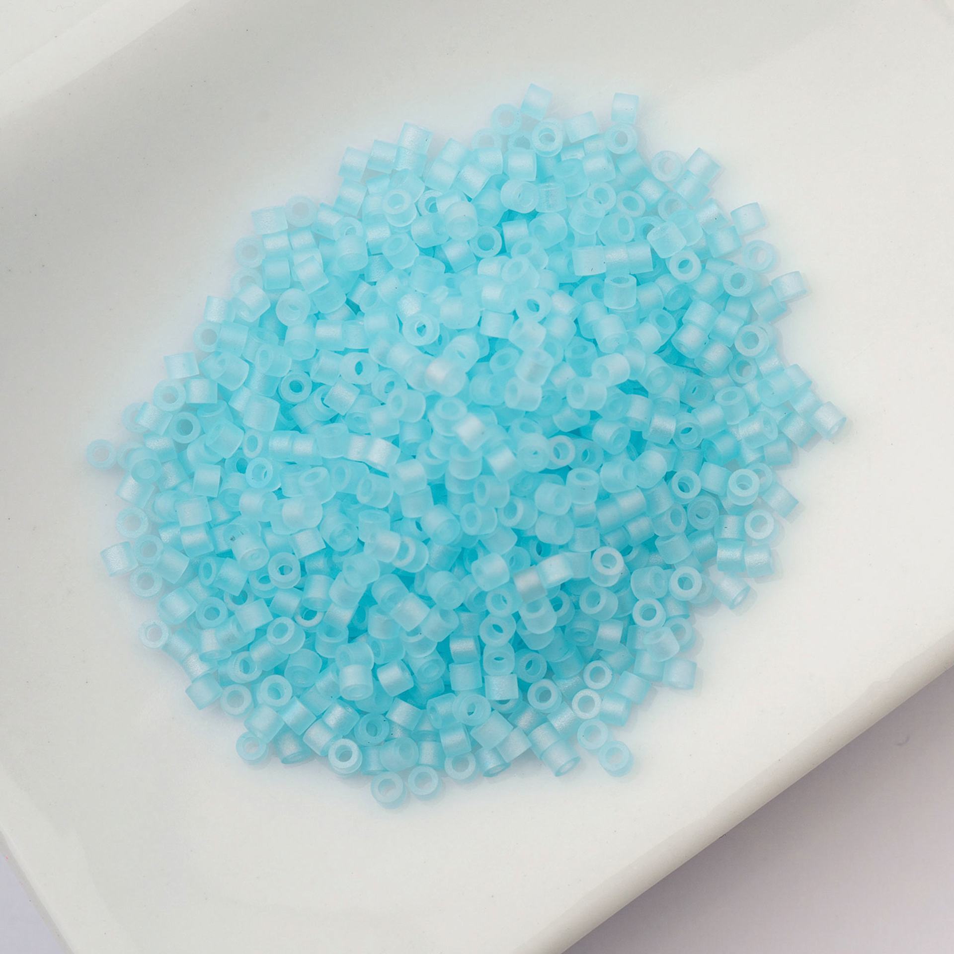 John Bead Cylin 11/0 Matte Macaron Cylindrical Seed Beads - Sky Blue AB sitting in dish