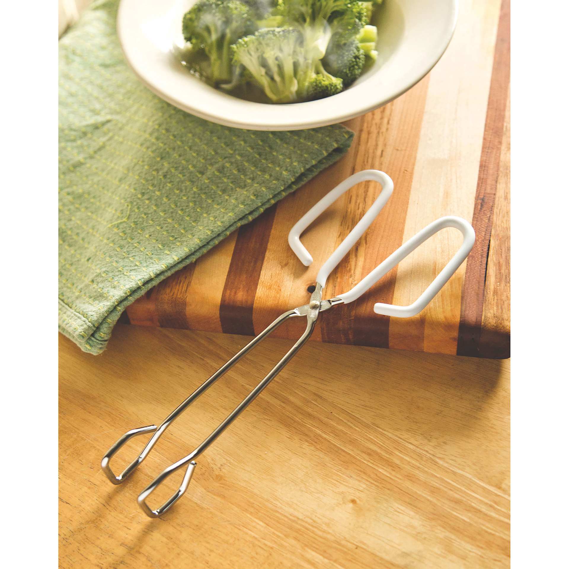 Fox Run Tongs sitting beside bowl of food