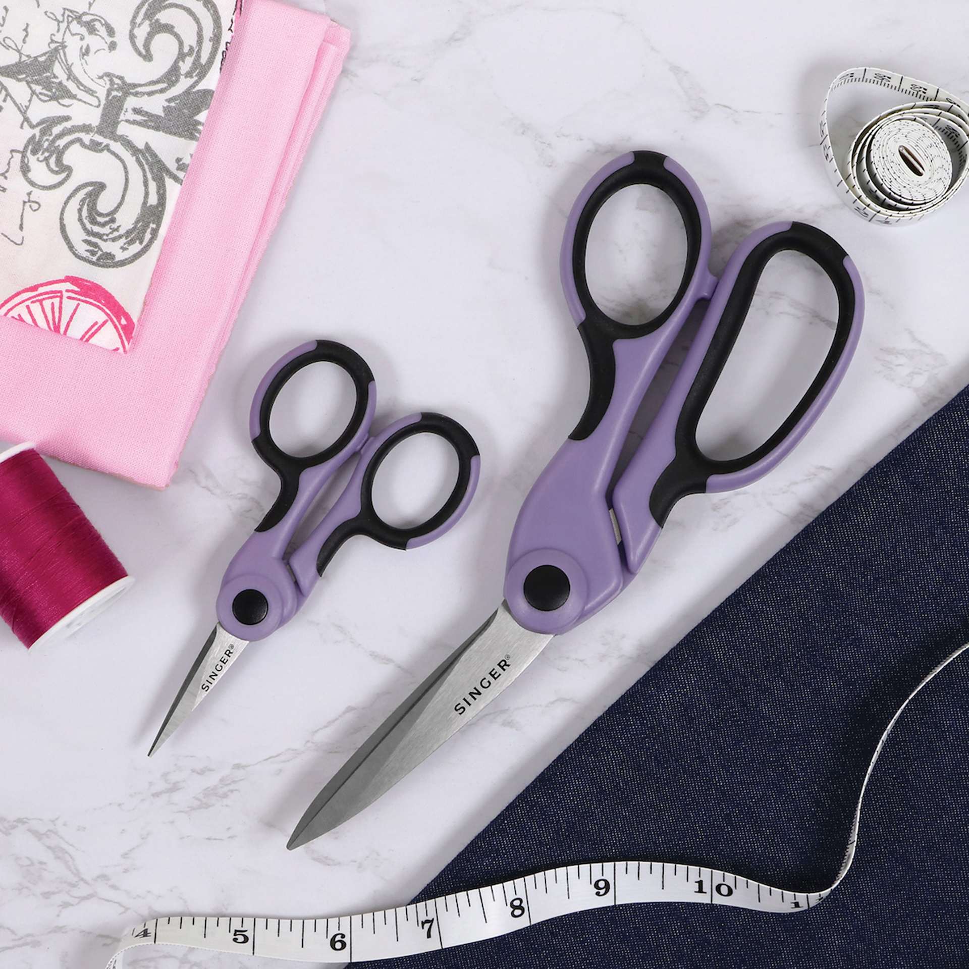 Singer ProSeries Fabric and Detail Scissor Set - Set of 2 laid on table