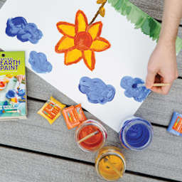 Natural Earth Paint Tempera Paint Powders - pigments mixed with water in jars, painting a yellow flower with blue clouds