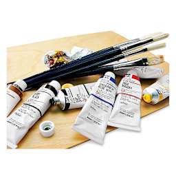 Holbein Artists' Oil Paints - Several tubes of paint, some open, shown on palette with 4 brushes