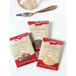 Natural Earth Paint Earth & Mineral Pigments and Set - pigments in packages laying beside a palette knife