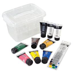 Liquitex Basics Acrylic Paint Set of 9, 2.5oz tubes. Clear box with tubes and brush set in front.