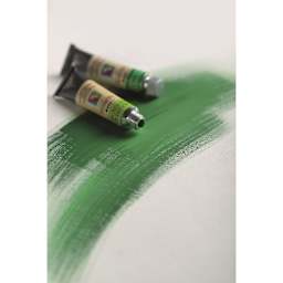 Maimeri Artist Gouache Tubes with green swatches of paint.