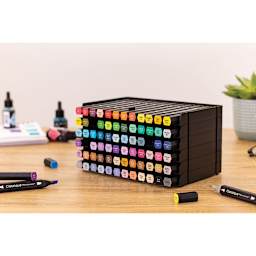 Spectrum Noir Marker Storage Trays - Black version shown on a table, filled with markers (not included)