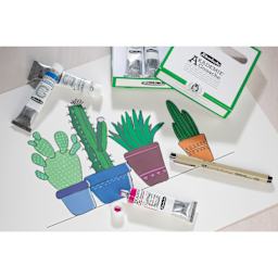 Schmincke Akademie CMYK Starter Gouache Paints laying beside cactus painting