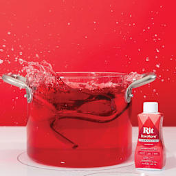 Rit DyeMore Synthetic Fiber Dye - Racing Red, 7 oz, submerging shoe in dyed water