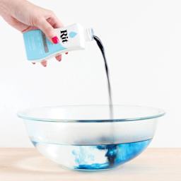 Rit All Purpose Liquid Dye - Aquamarine, 8 oz, pouring dye into bowl 