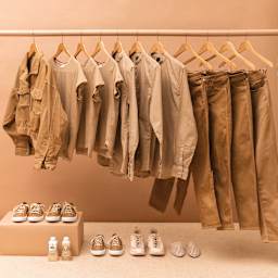 Rit All Purpose Liquid Dye - Tan, 8 oz, dyed clothes on a rack