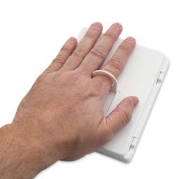 Hand showing ring on a closed set.
