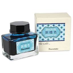 Kuretake Ink Cafe Meiji No Iro Pen Ink - 533 Sky Blue (Shimbashi-iro), jar next to packaging box