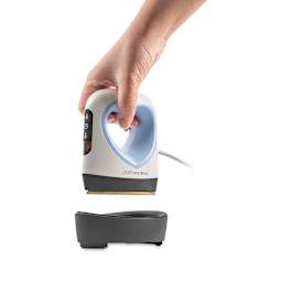 Craft Express Mini Heart Heat Press (held in hand over tray)