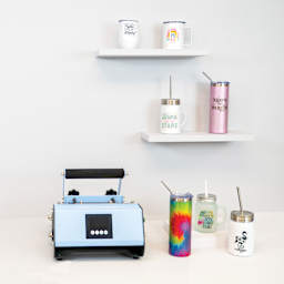 Craft Express Sublimation Elite Pro Tumbler Heat Press (on desk with finished drinkware examples)