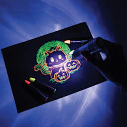 Micador Dark Arts Magic Black Light shining on a drawing that used fluorescent mediums.