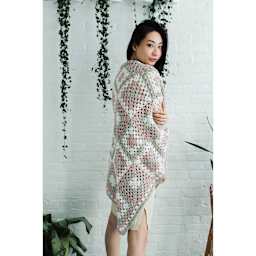 Lion Brand Feels Like Heaven Yarn, adult under blanket made of yarn