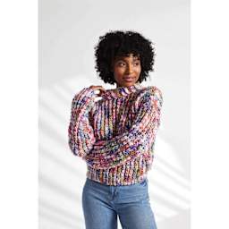 Premier Yarn Serenity Chunky Candy Yarn, adult wearing sweater made of multicolored yarn