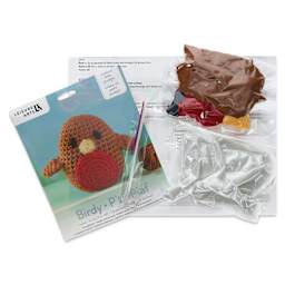 Leisure Arts Make a Little Pudgie Crochet Kit - Birdy, contents laid out
