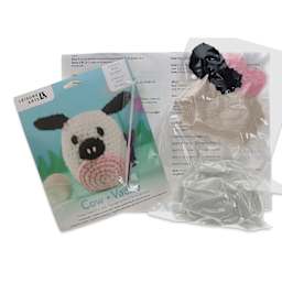 Leisure Arts Make a Little Pudgie Crochet Kit - Cow, contents laid out