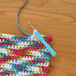 Boye Ergo Crochet Hook Sets - Cool color L hook in use (yarn not included)