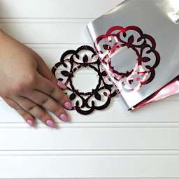 iCraft Deco Foil - Artist pulling silver foil off die cut paper wreath